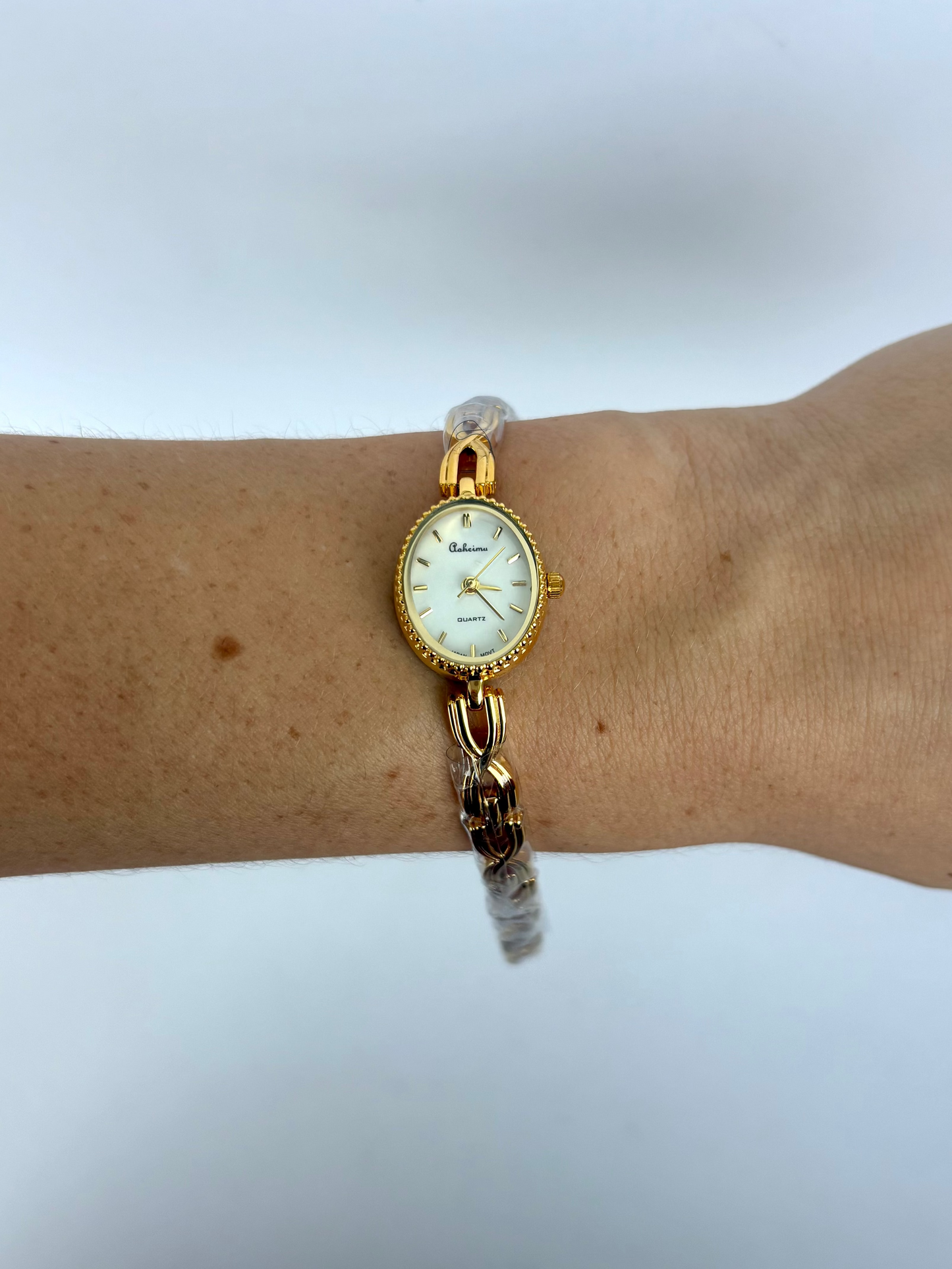 Dainty Gold Oval Dial Womens Watch