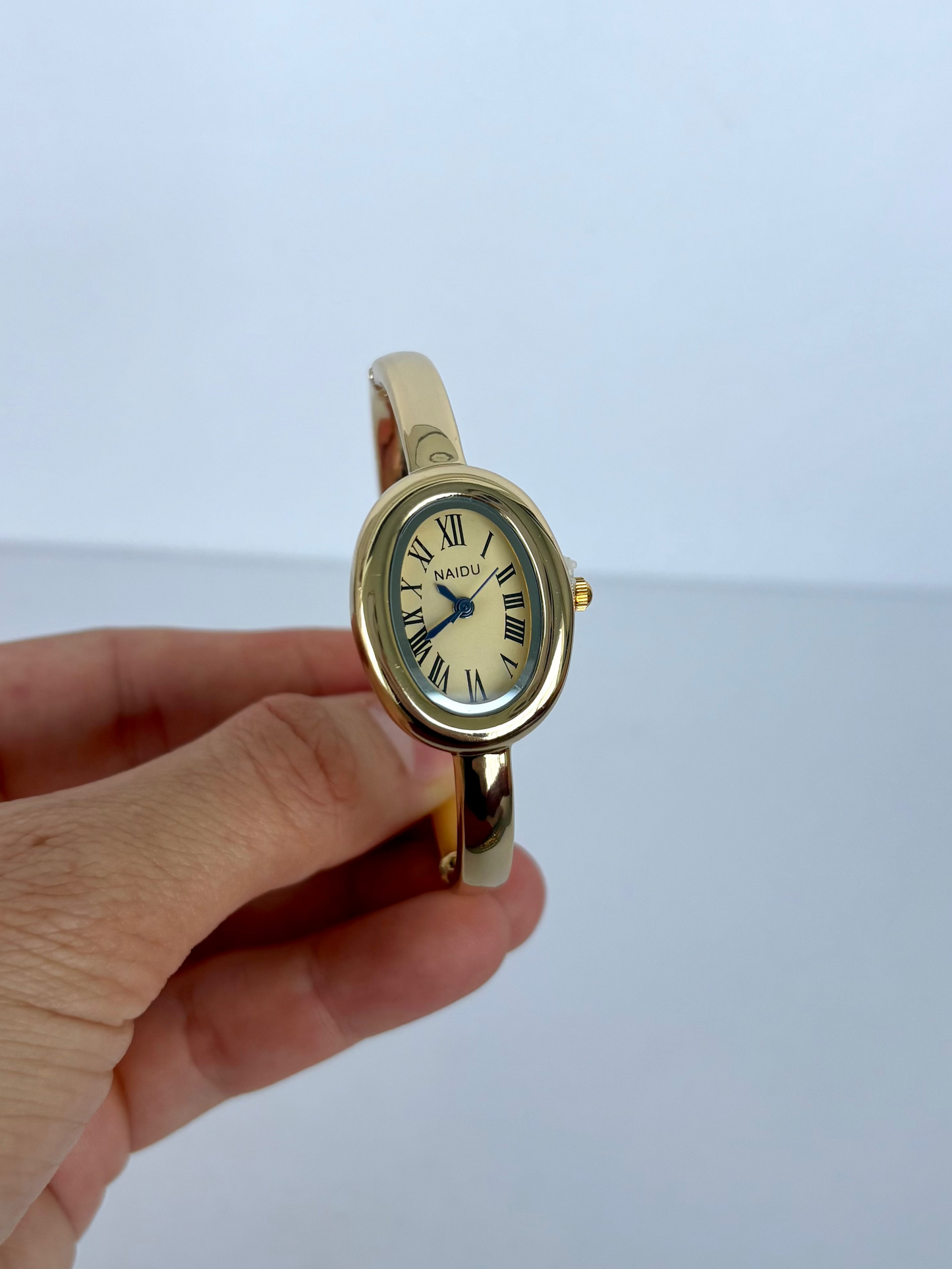 Gold Oval Dial Cusp Womens Watch