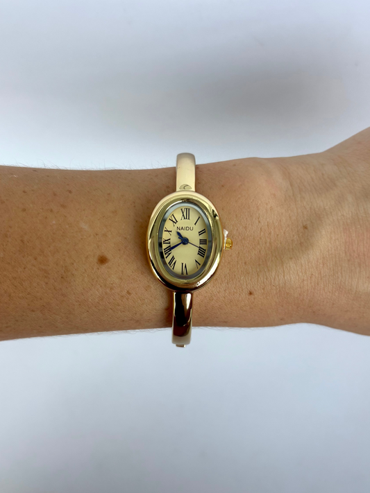 Gold Oval Dial Cusp Womens Watch